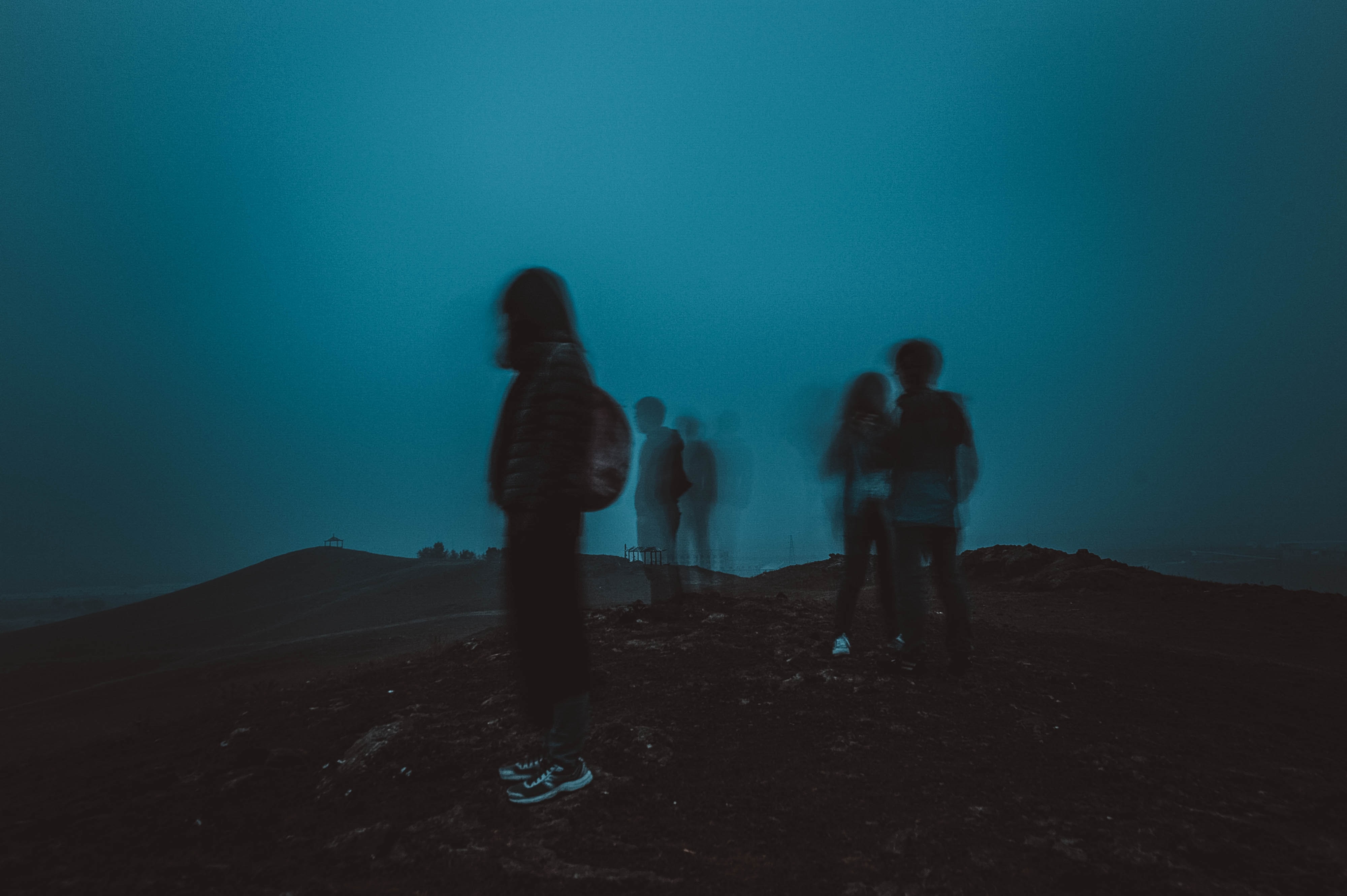 people standing on a mountain